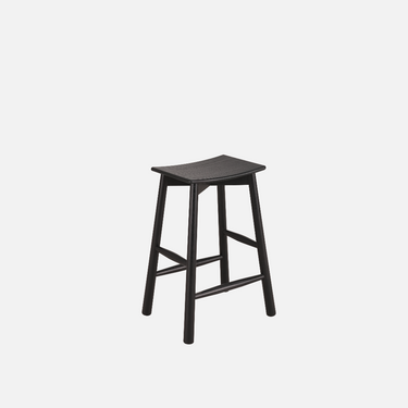 Olly stool in black ash with contoured seat and solid ash legs