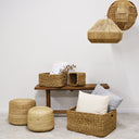 Round braided jute pouf natural styled in a living room
