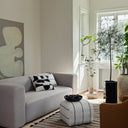 Broste Sigrid Pouf light beige black styled in a living room