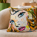Pop art comic blonde velvet cushion styled on a sofa