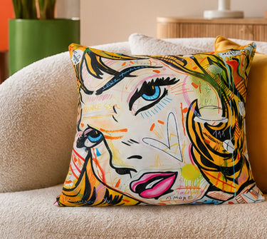 Pop art comic blonde velvet cushion styled on a sofa