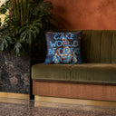 Some Cake slogan velvet cushion styled on a sofa