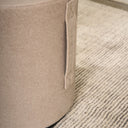 Mee Swivel Ottoman in a living room