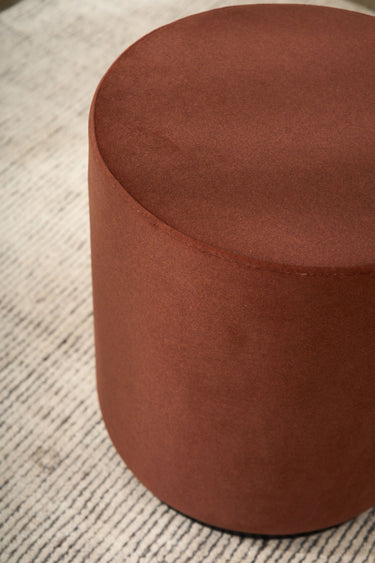 Mee Swivel Ottoman in a living room