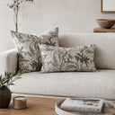 Green floral herringbone cushion styled on a sofa