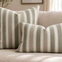 Striped green cushion styled on a sofa