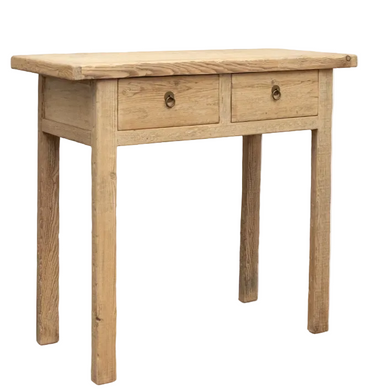 A rustic light oak wood writing desk with two drawers and small metal ring pulls, shown on a plain white background.