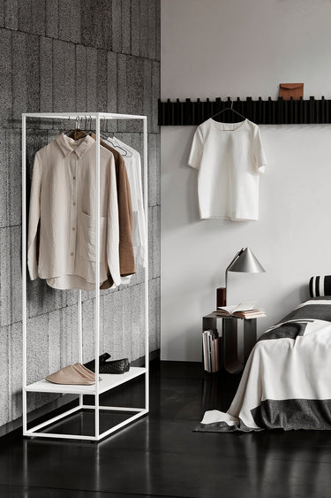 Kristina Dam Cone Table Lamp lit on a side table