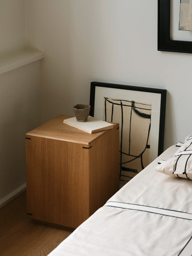 Kristina Dam Japanese Side Table in oak, showing the faceted surface and elevated base