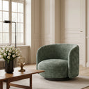 Harlow Swivel Chair in moss in an interior setting