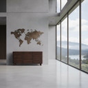A modern interior scene with a dark wood sideboard or credenza against a light gray wall, above a world map wall art piece. Large floor-to-ceiling windows reveal a mountain and lake landscape.