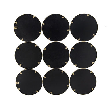 Gold ring grid mirror styled on a wall