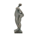 Detail of the abstracted head and shoulders on the lady figurine