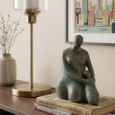 Side profile of the seated mother and child figurine