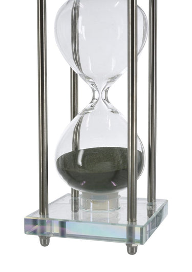 Close up of the green sand inside the blown glass hourglass