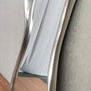 Vintage silver abstract mirror styled in a room