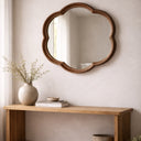 Walnut round squiggle mirror styled in a room