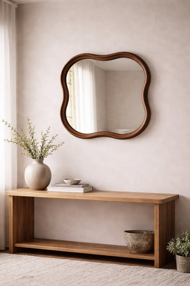 Walnut square squiggle mirror styled in a room