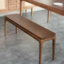 Baur Bench Seat angled view showing the tapered solid ash legs