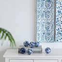 Six small porcelain orbs in blue and white, sized for bowls, trays and shelves