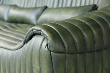 Cuban 2 Seater Leather Sofa in olive top-grain hide with a sculptural channel-ribbed silhouette