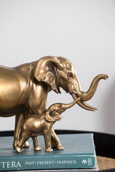Brass elephant ornament measuring L30.5 x W13.5 x H17.5cm, side view