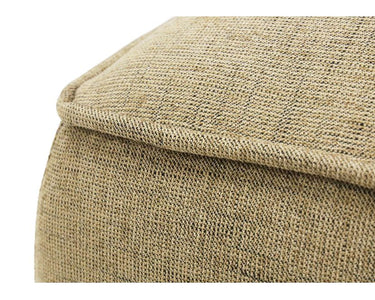 Angled view of the Nellie Small Ottoman in a practical textured neutral