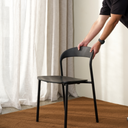 Black Olly dining chair being placed in a dining room