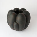 Tino Ceramic Vessel in black styled with a fresh arrangement