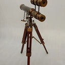 Double-barrel antique brass telescope with a parallel barrel beside the main telescope