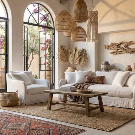 Modern living room featuring a cream fabric sofa, woven pendant lights, and a rustic wooden coffee table - 2026 furniture trends NZ.
