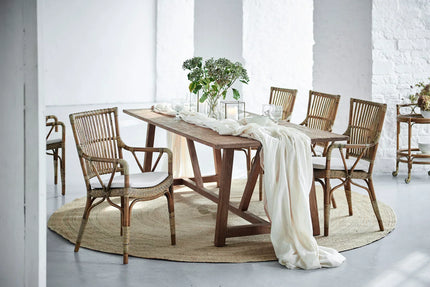 Sika Design handcrafted rattan armchair in a luxury interior — available at Online8 Auckland