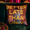 Better Late Than Ugly slogan velvet cushion styled on a sofa