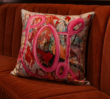 Abstract Pop velvet cushion styled on a sofa