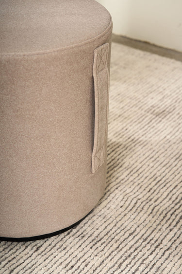 Mee Swivel Ottoman in a living room