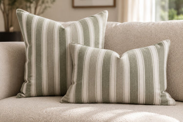 Striped green cushion styled on a sofa