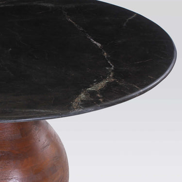 Orb Marble Dining Table, showing the orb-shaped mango wood pedestal base
