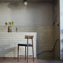 MUUBS Tetra barstool side view showing reclined backrest