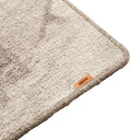 Close-up of the MUUBS Surface rug's grey and sand pattern