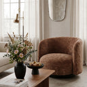 Harlow Swivel Chair in tobacco in an interior setting