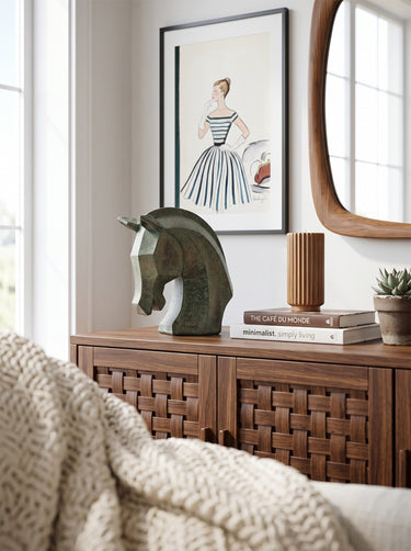 Mottled green and umber patina texture on the horse head sculpture