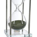 Close up of the green sand inside the large blown glass hourglass