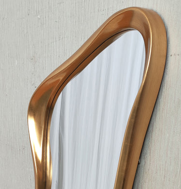 Sculptural gold frame detail