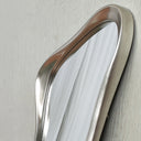 Sculptural silver frame detail
