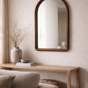 Walnut arch mirror styled in a room