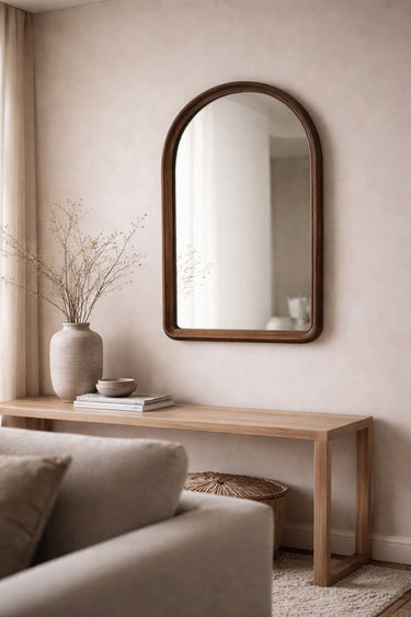 Walnut arch mirror styled in a room
