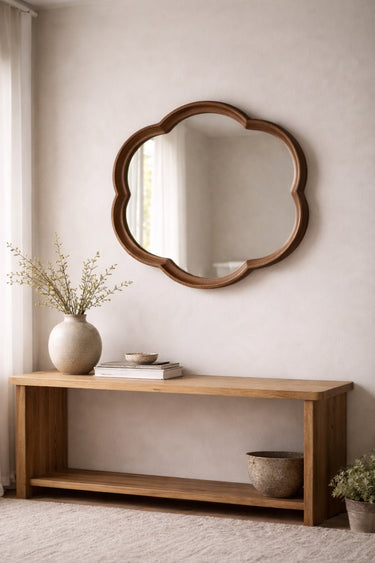 Walnut round squiggle mirror styled in a room
