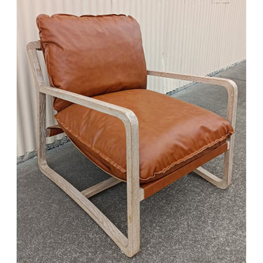Brown Accord Armchair with a foam-filled PU seat and slender oak legs