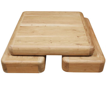 Angled view of the Bambam square acacia coffee table in a natural finish