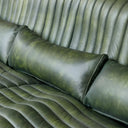 Cuban 3 Seater Leather Sofa in olive with a sculptural channel-ribbed silhouette and dark metal base